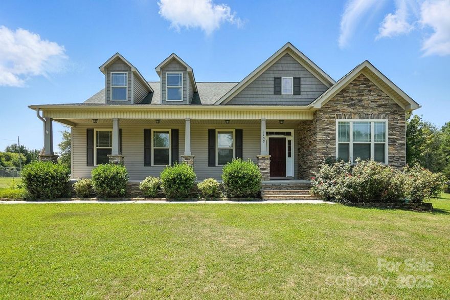 Welcome to 1409 Saint Paul Church Rd — a beautifully maintained home set on a spacious lot with room to fully enjoy. Savor those peaceful mornings or evening gatherings on the large covered front porch. Inside, you'll find generous living spaces, a kitchen with ample storage, and a large primary suite with walk-in closets and en-suite bathroom. The main level also hosts a guest bedroom and additional full bathroom. Upstairs offers a guest bedroom and one more full bath. The walk-in attic could be completed for more flex space. The fenced in backyard has a two-bay workshop and plenty of room for activities. This home offers comfort, flexibility, and value nestled right in Clover, home to top rated Clover schools, shopping, and Lake Wylie amenities. Schedule a showing today!