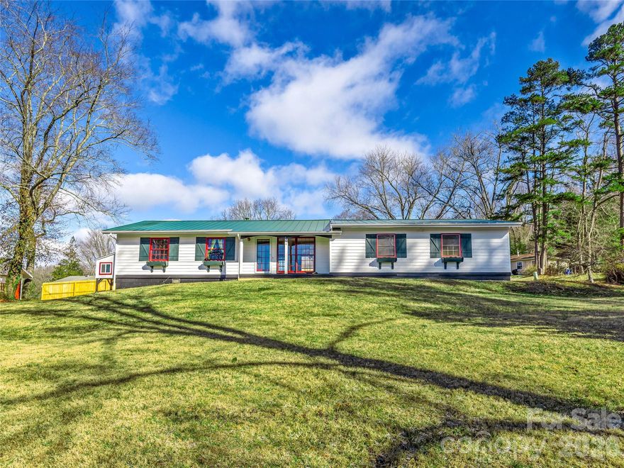 First time on the market! 

This quintessential ranch-style home at 34 Southwicke Drive in Arden is ready to welcome its next owners. 

Thoughtfully maintained and full of character, this 3-bedroom, 1.5-bath home offers 1,048 square feet of heated living area with a layout that is both cozy and functional.

The living room is a true highlight, featuring floor-to-ceiling glass that fills the space with natural light and showcases slate flooring for timeless style and durability. A beautiful metal roof adds both visual appeal and long-term, low-maintenance value.

An oversized two-car garage with additional workshop space provides excellent flexibility for hobbies, projects, or storage. The property also includes a detached storage shed ideal for tools or equipment. A fully encapsulated crawlspace with a fixed dehumidifier offers added peace of mind and enhanced moisture control.

Outdoor living is made easy with a back patio equipped with a retractable sunshade, perfect for relaxing or entertaining. The newly installed privacy fence creates a secluded backyard setting for pets, play, or quiet enjoyment.

Ideally situated in Arden, this home provides convenient access to Biltmore Park, local shopping, dining, and commuting routes while maintaining a quiet, neighborhood feel. 

With its thoughtful upgrades and timeless ranch-style appeal, this property is a standout opportunity not to be missed.