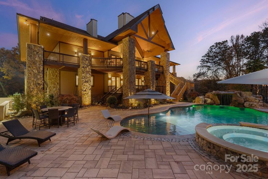 Welcome to a residence where innovation, elegance, and craftsmanship converge. This extraordinary estate is located in a private community with a 3,000-foot grass airstrip, offering rare convenience for aviation enthusiasts, and is positioned along the main channel of Lake Norman with a deeded boat slip and HydroHoist boat lift. Designed for those who appreciate modern luxury and effortless living, every detail reflects precision and purpose—from advanced automation and world-class entertainment spaces to resort-style outdoor living and a chef-caliber kitchen. Whether arriving by air, water, or road, this home delivers a lifestyle beyond compare.

Inside, more than 8,200+ square feet of thoughtfully planned living space includes a luxury primary suite with a modern spa-inspired bathroom, expansive custom closets, and serene views. Large secondary bedrooms, generous flex spaces, and a dedicated office provide versatility for work, guests, fitness, or multigenerational living. Every room was designed with comfort, flow, and elevated finishes in mind—perfect for both everyday living and large-scale entertaining.

A private home theater provides a true cinematic experience with ten reclining leather seats, a 120” Black Diamond Elite screen, JVC Pro projector, Klipsch Reference Premiere 11.2 surround system, dual high-performance subwoofers, and triple insulation for superior sound containment.

Security and resilience are built into the home’s design. A reinforced underground safe room and walk-in vault house an 8TB DVR system monitoring 25 high-definition cameras. A CPI alarm system and two hardwired 22kW generators—powered by 1,000-gallon and 250-gallon propane tanks—can independently run the entire property for days and perform automatic self-tests.

Outdoor living rivals luxury resorts. The saltwater pool and spa are fully automated through the Hayward OmniLogic system, allowing remote control of all functions. An Ambisonic Origin Acoustics sound system with dedicated zones for the pool and firepit lounge creates an immersive entertainment environment enhanced by a buried subwoofer. The grounds feature extensive automated irrigation and hundreds of tons of decorative stone for a low-maintenance, timeless landscape.

Water quality is ensured by a Rockwell five-stage purification system with UV filtration. The main level is pre-plumbed for radiant heating, and the climate-controlled garage keeps vehicles and equipment in pristine condition. All utilities and systems were engineered with efficiency and ease of use in mind.

The gourmet kitchen is a chef’s dream, featuring Viking Professional double ovens, an 8-burner 48” Viking gas range with downdraft, Viking microwave, GE Monogram refrigerator and wine cooler, GE Monogram dishwasher, and a JennAir under-counter ice maker. A large walk-in pantry with custom cabinetry provides exceptional storage and functionality.

This estate uniquely blends aviation convenience with waterfront living. Direct access to the private airstrip makes travel effortless, while the deeded boat slip offers instant entry to Lake Norman’s main channel for boating, fishing, or cruising at sunset. This property invites you to live a lifestyle without limits—luxurious, connected, and truly one of a kind.