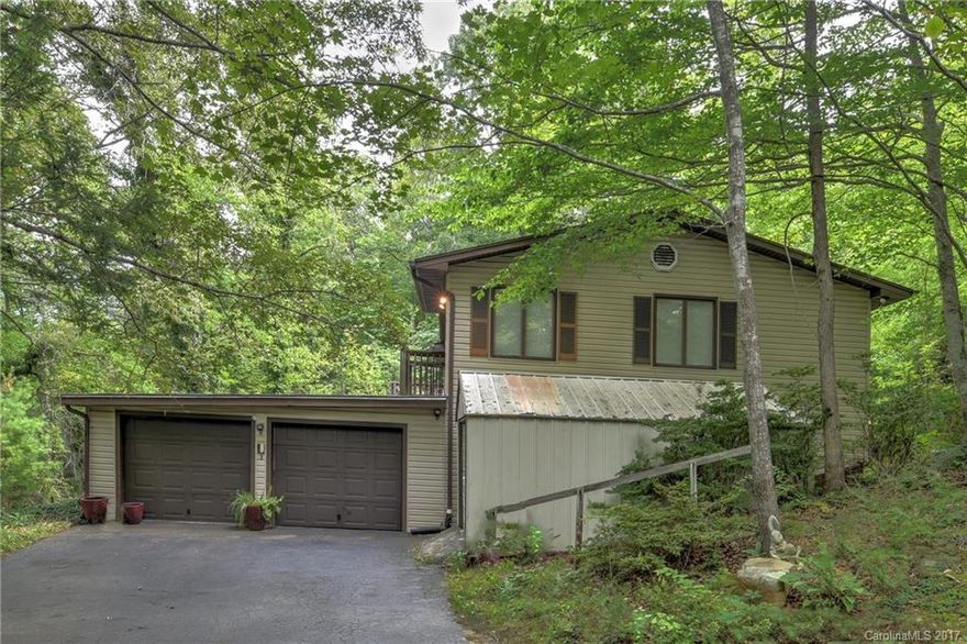 Much potential in this home for first time home owner/investor!  3 bedrooms and 2 baths upstairs and an additional 2nd kitchen, living room, and bathroom downstairs.  Good size rooms. Master has deck access.  Private, wooded lot.  Property being sold as is. Seller is motivated to sell. Settling estate sale. Go and show- check instructions. Additional land available. No rental Restrictions, close to the Blue Ridge Parkway. Located in the county