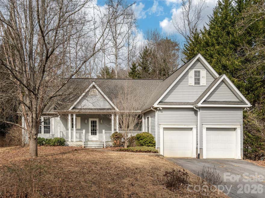 A great beginning starts here.  This home is located  in a private convenient neighborhood, close to the Va Hospital, downtown Asheville and Black Mountain. Nice open floor plan, from the front door you'll enter the great room
with high vaulted ceilings and a wall of windows full of light over looking your large back deck. Built in bookcases surrounds the fireplace, wainscoting, chair railing, and shaker cabinetry gives you a warm Arts & Crafts feeling throughout the home..  Split bedroom floor plan with a upper bonus room that could be an office, craft room, play room, or any thing you need.  The covered front porch is big enough for some rocking chairs and sweet tea.  Back deck is off the great room and dining area.. Lots of plants and trees on this large corner yard.  The attached two car garage has very high ceilings and lots of storage.  Just add some fresh paint and carpet in 2 bedrooms to make it your own sweet home.