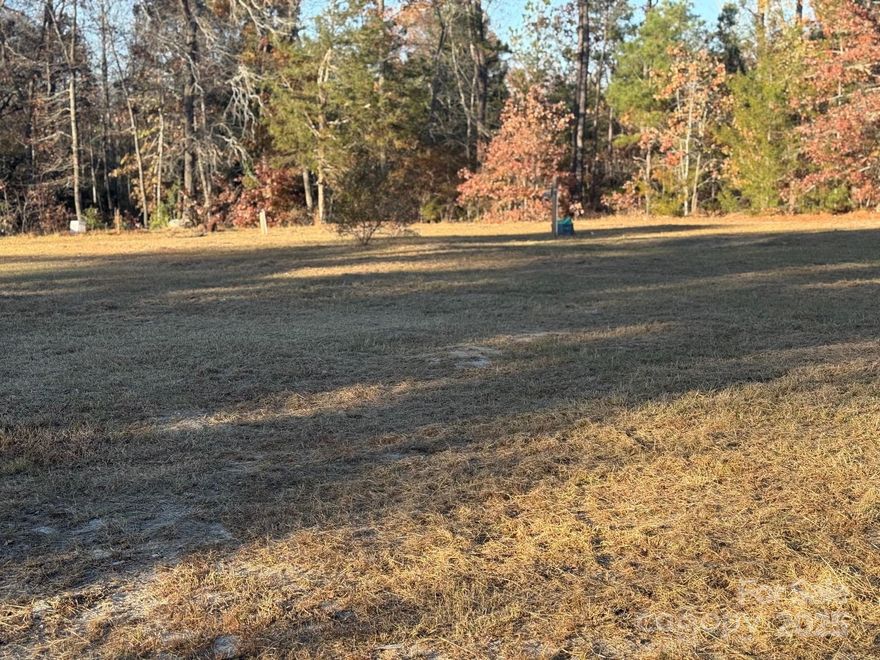 This 1 acre lot is approx. 1 mile out of the town limits of Kershaw, Its cleared & ready for a home to be placed on it.  It has county water/septic & Power already in place.  It's back off the road for privacy  ONE ACRE is hard to find!  Let this LOT BE YOURS!