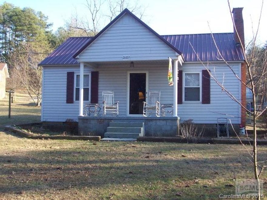 COZY 2BD 1BA on 0.85 acre lot conveniently located between Hickory and Morganton!! Updates include LIFETIME METAL ROOF,VINYL SIDING,INSULATED WINDOWS,KITCHEN CABINETS AND COUNTERS,FLOORING,WHIRLPOOL TUB,2 CARPORTS, AND OUTBUILDING WITH POWER all within last few years!!!!Well located on property needs repair...Flue needs liner per owner and is currently not being used. Flat carport over camper and propane heater in LR does not convey with property. GREAT STARTER HOME... PERFECT FOR DOWN SIZING OR RENTAL PROPERTY...PRICED TO SALE AT $69,900.