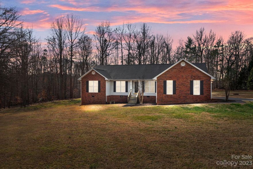 OPEN HOUSE CANCELLED! This 3 bedroom, 2 bathroom home is tucked away on a private road, while being minutes from I-85 providing the perfect blend of tranquility and convenience. You'll love the spacious bedrooms, additional flex room, eat-in kitchen, separate dining room, and large living room for a comfortable entertaining space. Mentionable upgrades include a whole house water conditioning system, tankless water heater as well as electric water heater, and the perimeter of the fence is already wired for an invisible fence system. Step out into the sunroom that overlooks the beautiful in-ground pool, creating a perfect oasis for outdoor relaxation, ideal for hot summer days and quiet nights. The 1.5 acre lot includes an expansive 30x40 workshop that provides ample space for hobbies or storage. Shop has 220 outlets and a 50 amp service for RV/camper hookup and the shed behind the pool has electricity as well.