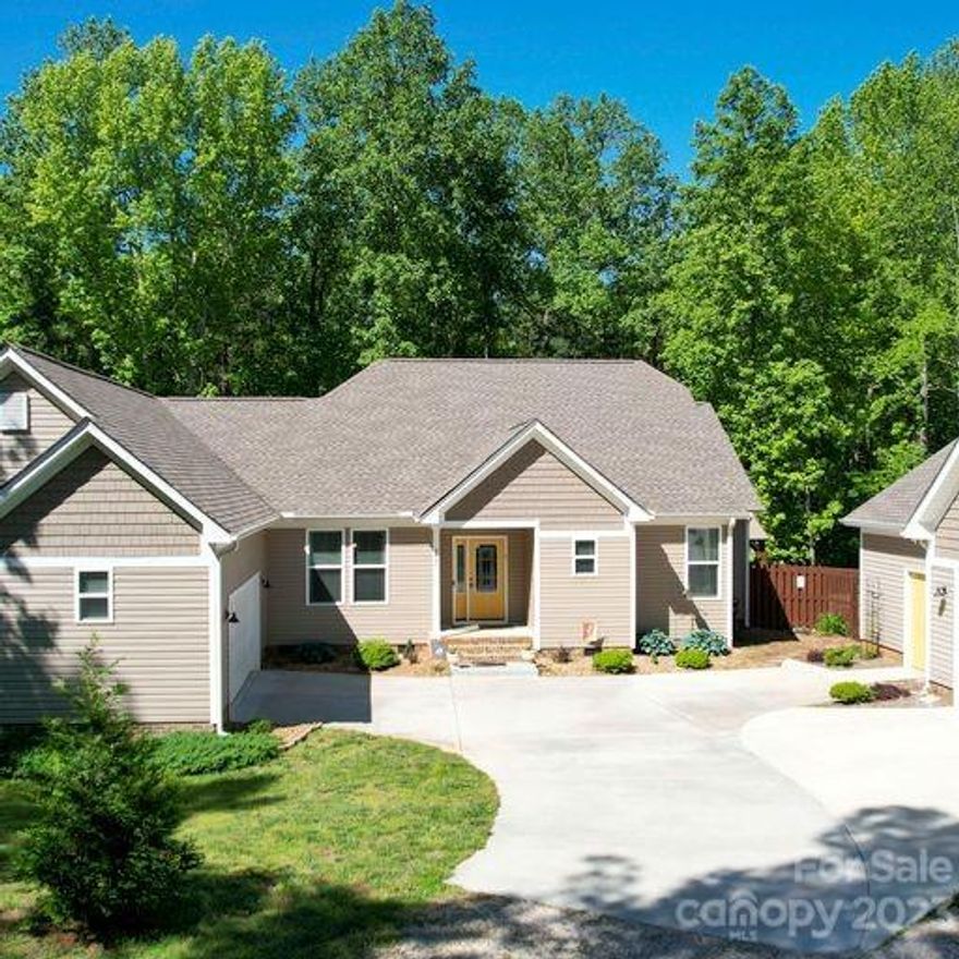 Private country home, nestled in the small town of Van Wyck. Sitting on 2 acres of wooded land this home features 4 bedrooms 2 full baths, and 4 car garage. Upon entering this home, you will fall in love with the bamboo flooring through out the common area. Living room overlooks the private backyard with plenty of space for entertaining. A gas range, and stainless steel appliances with large island and sink that overlooks your back patio is the perfect space for the family cook. Primary bedroom is tucked away from the other 3 bedrooms, with one currently set up as an office. Fenced in back and side yard with raised garden beds, drip system irrigation, covered pergola, paver patio and entrance to your workshop. The detached 2 car garage, with french doors opening up to a woodworking workshop, has reinforced steel bars and concrete, to support a car lift. Both detached garage, and workshop are wired for electric, and have a split system for hot summer days. Incapsulated Crawlspace.