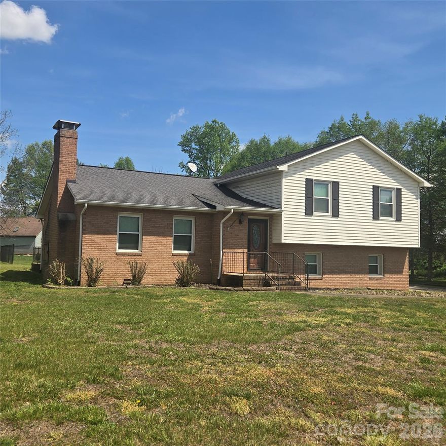 Location, location, location.  This beautiful home is located in a quiet, convenient yet very country neighborhood just minutes from Statesville's largest retail area, close to schools, churches , shopping and close to town.....this is a well established and stable neighborhood.  Featuring a split level style this home has a very nice entrance into a spacious living room with cathedral ceilings, a beautiful stone fireplace,  matching high profile ceiling fans and then  continues  into a large dining area with access to the large concrete pation that overlooks a fenced back yard, perfect for having pets.  Also on the main level is a modern kitchen area with matching oven, microwave and dishwasher, granite countertops and a small pantry area. Then just a few stairs up is the upper area with 2 large bedrooms and 2 full bathrooms,  all modern with ceiling fans,  carpeted, large closets and  comfortable in size.   Then,  a few steps down from the main floor is the lower level which is the garage/utility area and it leads out to the driveway.  This area is centrally heated and carpeted and has been used as a living area also but it is not included in the heated area square footage .   This is a dream home for any family wanting convenience, country setting, quiet, established neighborhood, quality construction, spacious living area and very pet friendly.
