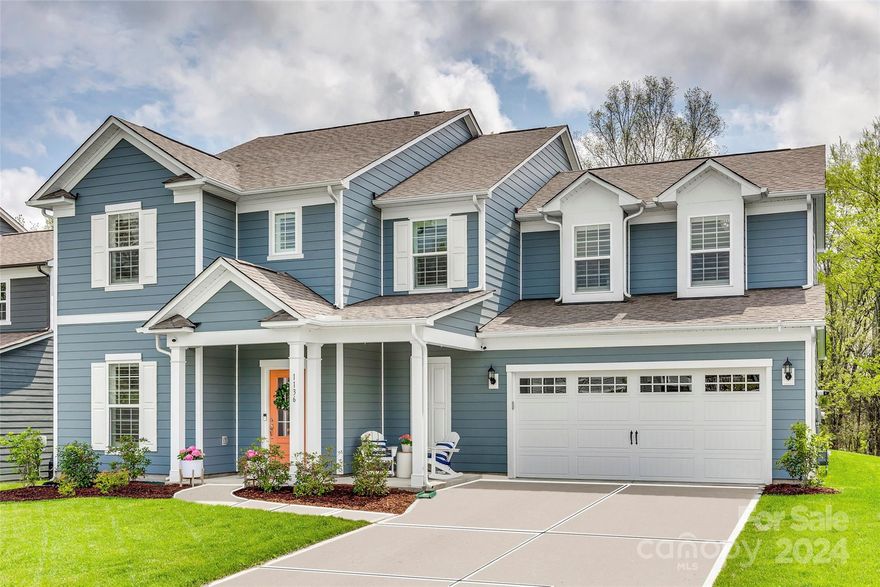 Unmatched quality, this better-than-new McCullough home is seeping w/ charm! A relaxing front porch greets you as you make your way in on stunning LVP floors that run throughout the downstairs common areas. The chef's kitchen is sure to impress w/ SS hood, gas range, convection microwave, gleaming quartz counters, farmhouse sink, walk-in pantry, expansive island, & butlers pantry! A bright sunroom gives you extra space off the great room, as well as planning/office area & mudroom tucked away & downstairs guest bed w/ ensuite. Tons of added upgrades done incl gold finish hardware, plantation shutters throughout, tankless water heater, designer light fixtures, & custom built storage in the loft & a bedroom that can convey. The home backs up to a private wooded area, & is situated on a cul-de-sac. McCullough is a lifestyle rich community whose amenities incl 2 pools, sport courts, dog park, etc, & within minutes of downtown Pineville! Check out the video here: https://youtu.be/ymiw-Zuj4FA