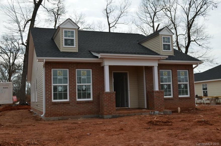 An enlarged version of our most popular plan.  This 3BR/2Ba home has a cathedral ceiling in the great room, ceiling fans in the GR and MBR, and a nice size laundry room with cabinets.  The kitchen features ceramic tile flooring, granite counter top, and a tile backsplash.  Kitchen appliances include stove and built-in microwave.  Baths will have a culture marble top and ceramic tile floors.  Plans are not exact and builder reserves the right to make changes.  Buy today and pick out your colors.