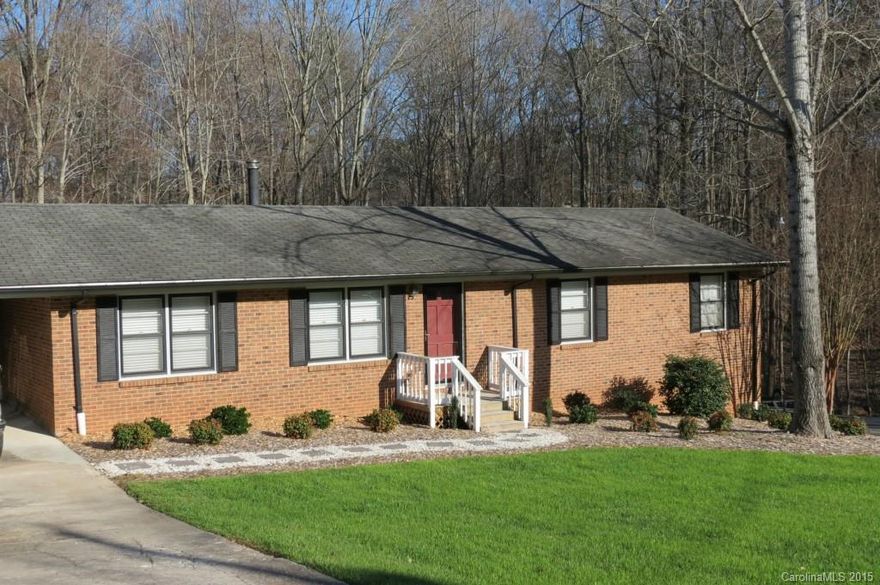 Well maintained, move in ready brick ranch with a basement on a large mature lot.  The home has a large den, an updated kitchen, living room, a screened porch, the carport, and 3 bedrooms are on the main.  The basement has large finished room that can be a bonus room and media room.  There is already projection unit and screen in place.  Also you will find a one car garage with plenty of working room/shop.  This is perfect home for a owners with ATV's/lawn care equip.,  and other toys.