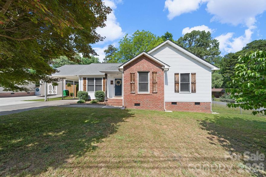 Cute, cozy, and just the right amount of charm!
Welcome home to this adorable 1993-built gem tucked away on a corner lot along a quiet street in the heart of Bessemer City! Just minutes from downtown, local shopping, dining, and Bessemer City Schools, this home offers convenience without the traffic noise. 
Inside, you’ll find updated flooring, refreshed bathrooms, and a stylish built-in electric fireplace that not only looks good but actually throws off a little heat too.
The three bedrooms and 2 full baths are enough for comfortable living. 
Step outside to enjoy the rear deck, perfect for morning coffee, evening unwinding, or grilling. The exterior features a low-maintenance mix of partial brick and vinyl siding, plus a single carport for keeping your vehicle out of the elements.
This one is cute, practical, and move-in ready—schedule your showing now!