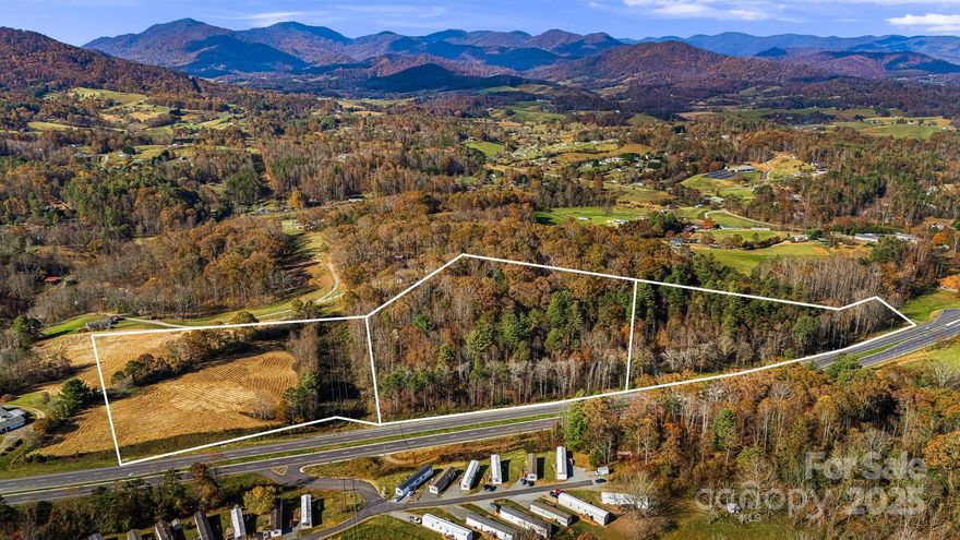 This 28.74 acreage offers endless possibilities with open use zoning. Located just 15 minutes from downtown Asheville, these prime parcels offers rolling countryside, stunning mountain views, and easy access with 4-lane frontage on NC Hwy 63. With developable topography and additional frontage on Brookshire Rd (SR 1302), this site is ideal for future development and offers the flexibility to bring your vision to life. If desired, the neighboring property with 3.155 additional acres and a brick home can be purchased together. See MLS#4192786
