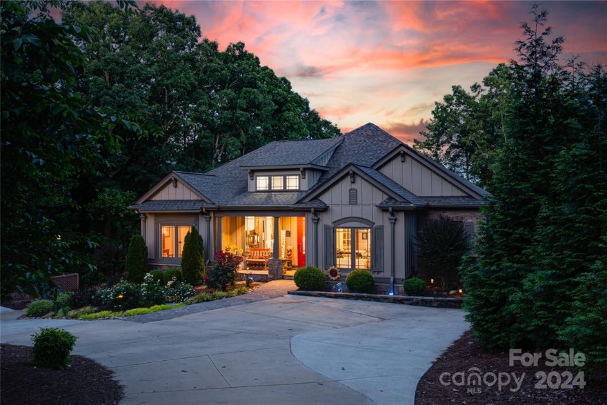 The view is a stunner at this beautiful custom-built home located in the much sought after subdivision of Heron Bay. A new modern kitchen is the centerpiece of this home ready for entertaining. The open floor plan extends out onto the covered porch where relaxing days are spent. Three bedrooms on the first floor includes the owner's suite of your dreams with doors to the deck for sunrise views.  An office rounds out the first floor where you will also find a laundry/ powder room combo. The walkout basement includes additional space for a long-term guest or mother-in-law suite complete with a custom kitchen. The bonus room downstairs can be used as a bedroom, additional office space or perhaps a theatre room. This space also walks out to a covered patio with a custom fire pit for cool nights. Storage space galore in both the upstairs walk up attic and the two-car garage with lots of room for toys. The shared covered pier is an easy walk from the home with a concrete sloped walkway.