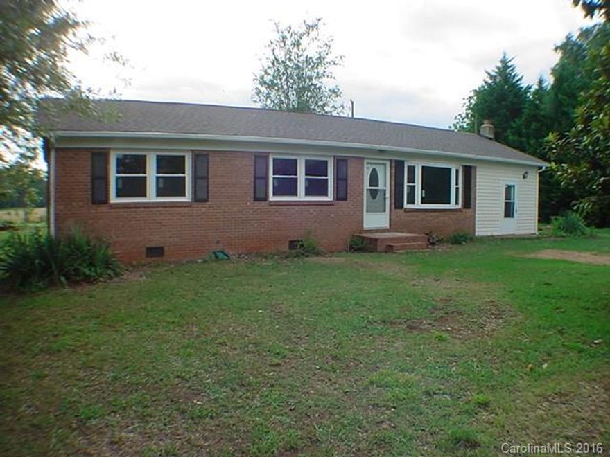Lovely Ranch home in the process of being remodeled with a new roof, paint, flooring, new light fixtures, new heat pump, remodeled bathrooms and master bedroom with private half bath. Large partially covered deck with a beautiful leveled yard.