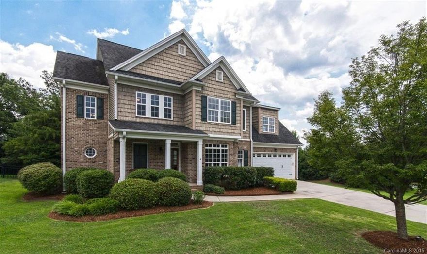 Beautiful brick home in the Overlook! 4 bedrooms, 3 full baths, Open floor plan with spacious LR, DR & kitchen.  Large fenced in, mature trees & landscaping. Home features hardwoods on main & in master suite. Kitchen w/ granite countertops & tile backsplash with stainless steel appliances.  1st floor guest suite w/ full bath.  New Paint and Carpet throughout! 2600+ sq ft of HLA. Upper level has a large BR. Master suite w/ engineered HW floors, tile in MB w/ separate garden tub & walk in shower.