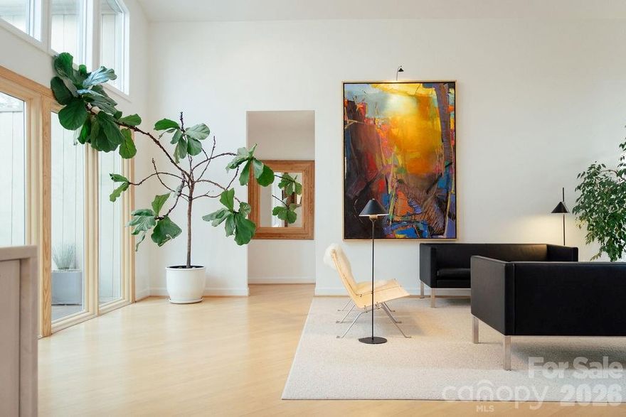 Escape to Your Private Wooded Retreat in Providence Plantation. Discover the perfect harmony of nature and design at 2412 Houston Branch. Sitting on almost two acres of private serenity, this meticulously maintained home was designed and built by the current owners in 1980. Step inside to experience a perfect fusion of Mid-Century character and crisp Scandinavian influence, where walls of windows flood the space with light and truly bring the outdoors in. The heart of the home is the stunningly renovated kitchen, designed as much for function as for style. It features a massive eat-in island with huge deep drawers and a spacious pull-out pantry, ensuring an incredible amount of storage. The thoughtful floor plan includes a coveted primary suite on the main level and renovated bathrooms throughout. Need room to grow? The finished, climate-controlled space above the attached garage is ready for your vision. In the spring the grounds showcase natural flower beds that have been cared for over decades. Whether you are an avid gardener or just enjoy the view, you’ll appreciate the additional fenced-in raised bed garden—perfectly designed to keep your summer harvest safe from your woodland neighbors, the deer. Complete with an IPE deck to enjoy all seasons out in nature. Come see for yourself why this unique property is the perfect setting for your next chapter.