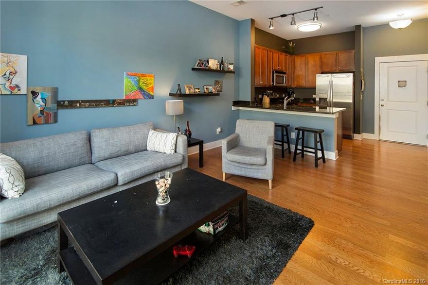 LOCATION! LOCATION! LOCATION! Live in the vibrant NoDa area in a contemporary corner unit condo with a very open floor plan. This condo has all the upgrades...granite counters, stainless steel appliances and hard wood floors! Walking distance to The Blind Pig and Solstice Tavern! You will love this condo! Best value in the area!