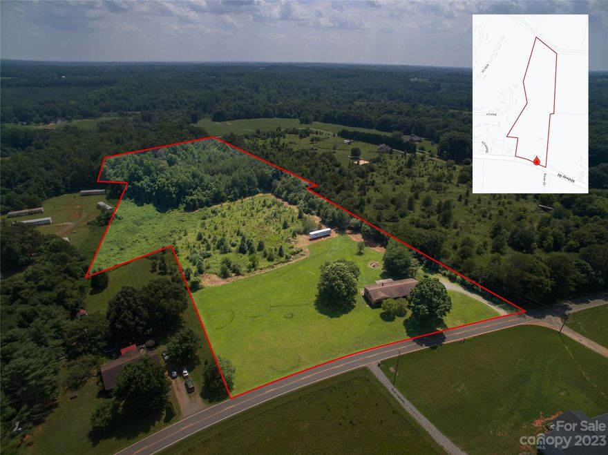 Back on the market at NO fault to the sellers. If you have looked before come back now the estate items are gone  you can see the home cleaned out.   Enjoy Country living in this 3/2 Brick Ranch with Full Basement and 2 Car Garage and a large 11.84 acres.  If you are dreaming of a Mini Farm, this is the place for you.  Plenty of room for pasture and future barns.  Geothermal Heating System -  Double-Paned Tilt In Windows for easy cleaning - High Ceiling in basement would give plenty of room to Finish in for extra square footage in future. This could possibly go FHA bring an offer and see.