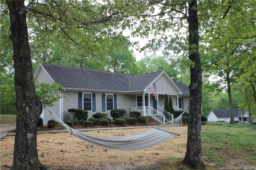 Come home to the country Low Cherokee county taxes . 3 bedrooms,  2 full baths, large heated area that could be used as a workshop or a rec room over 1800 square feet on almost an acre of land. Laminate floors through out this one want last long .Convenient to Highway 5 and I-85 .