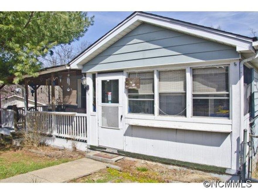 West Asheville home on double corner lot, convenient to schools and shopping. Solid 1950's construction with additions for workshop and laundry/storage areas(~600sf). Garden plat, deck in place for above ground pool,partially wooded back lot-potential home site for investors. Newer heat pump and roof, separate oil monitor heat for unf-basement. Spacious kitchen with pantry. Great neighborhood and minutes to downtown or I-40.