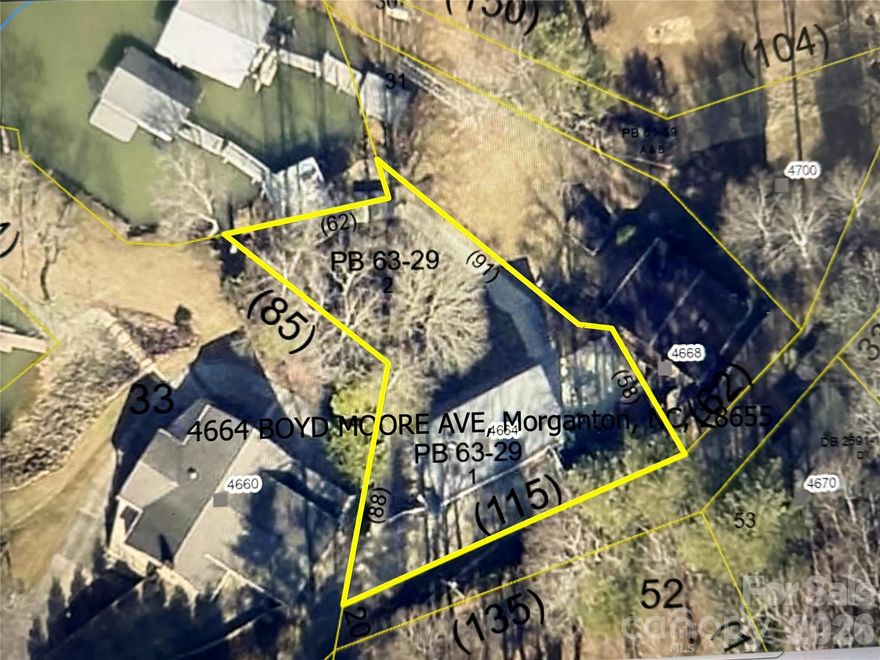 Adorable and updated home on sought-after Lake James. This property offers a gentle and short distance to your personal covered boat dock and the water’s edge. Stylish and updated inside with an open-concept layout. On the main level, find 2 ample-sized bedrooms, a full bathroom, and a living room. On the finished lower level, you have the open living, kitchen, and dining area, along with a finished room used as a 3rd bedroom. The primary offers a true walk-in closet and a private, updated full bath! Outside, enjoy the composite deck and lower poured patio, along with a level, graded yard all the way to the water! Updated HVAC, replacement windows, metal roof, and so much more. Plentiful storage areas outside and in the laundry room.