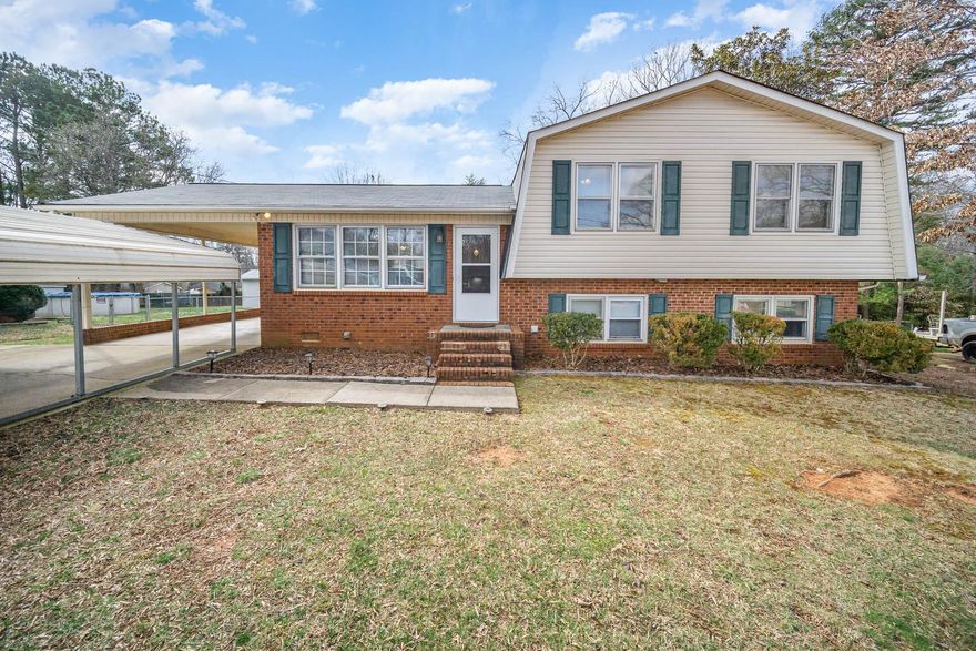This quaint split level home is nestled between the fabulous downtown Kannapolis and great shopping and eateries in Salisbury.  Walk into the formal living room which opens to the inviting kitchen.  In the basement, you will find a large family room with French doors that opens to a large sunroom where you can enjoy the flat backyard view which is your canvas to make it your own oasis.  The 3 bedroom 1.5 bathroom home sits on a little over a quarter acre and the primary bedroom is moderately sized with a half bathroom.  The remaining two bedrooms have a nice size and are all located on the upper level.  This home is located in a well established quiet neighborhood and is move-in ready.  Schedule your showing to see it today before it's too late!