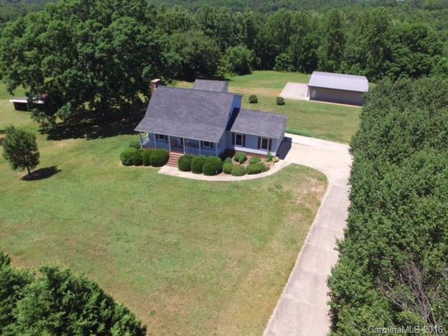 Master on main or upper All bedrooms have attached bathroom Auto Race Shop 2000 SF metal building 10 FT rollup doors Heat A/C Sealed Cement Floors Air Compressor Car Lift Go Cart Dirt Track  Zoned RA, Granite/Hardwoods  Finished basement  Detached Garage/workshop plus 2 car side load garage. Also includes Parcel 4740-56-8913 2.75acres.  Stream/ walking trails. No HOA. Close to I-77. Home Warranty extra room on main with a closet and door to bath