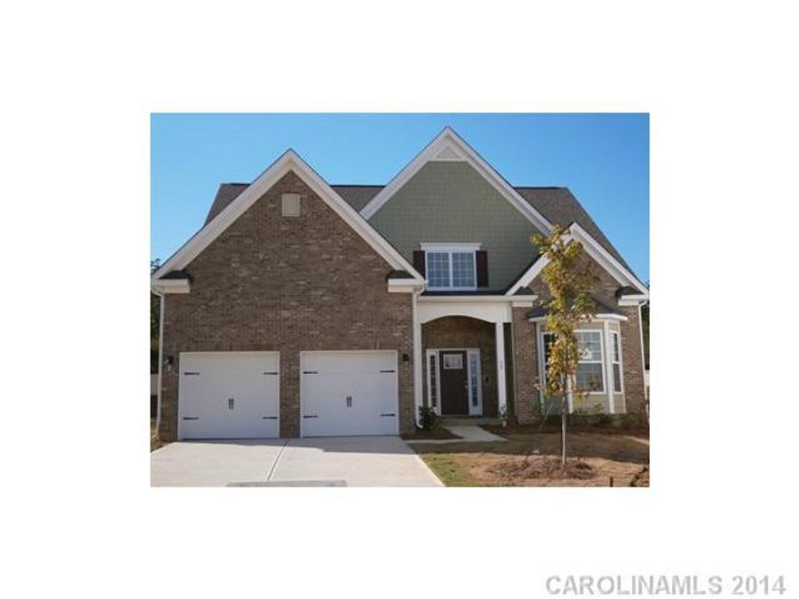 Two story Family Room with awesome rounded windows. Master on 1st floor. Hardwoods, Granite & Gourmet Kitchen with Double Ovens & Gas cook top plus Stainless appliances.  Gas fireplace!