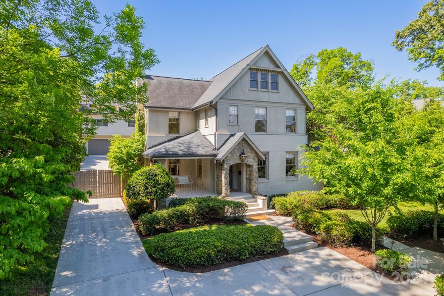 This quintessential Myers Park 1935 home was completely renovated and expanded in 2014 and sits on a rare  ~1/2 acre lot. Cozy rooms coupled with expansive indoor and outdoor living spaces allow for easy entertaining. 4 fireplaces are located around the house. Gaze at the fabulous tiered backyard complete w/ gleaming pool and spa while cooking or hosting in the beautiful kitchen. The lush landscaping provides additional gathering spots for coffee or cocktails. Above the 2-car garage is an elegant guest suite, with dual decks for extra leisure options. The main floor has a coveted drop zone & laundry room off the patio for wet towels, backpacks, and handbags. The primary suite is privately situated at the far end of the main floor and offers access to the resort-like outdoor space. Upstairs are 3 addt'l bedrooms and 2 full baths. Easily walk to restaurants, grocery, retail, and the Greenway that lies at the end of the street! A must see! It's more than a home – it is a lifestyle!