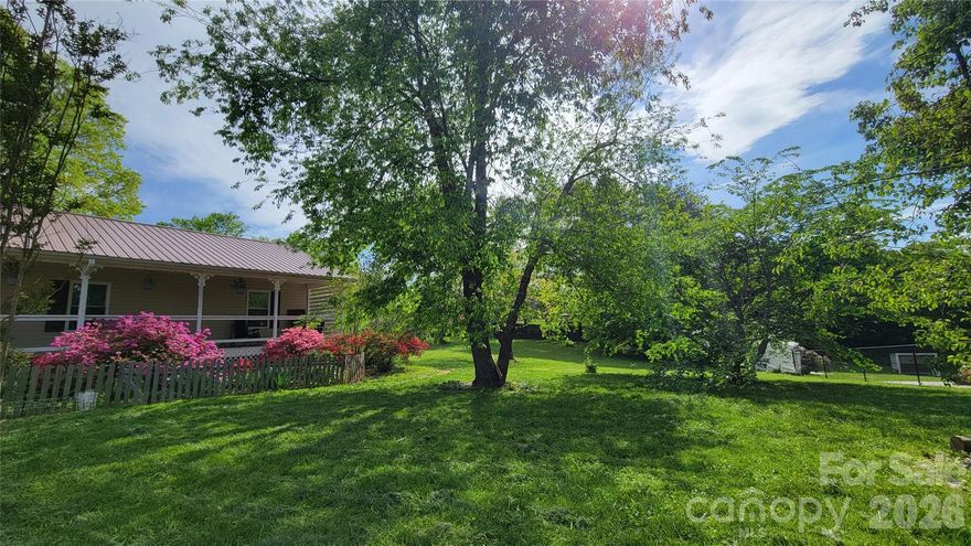 This beautifully maintained 3-bedroom, 2-bath home offers a spacious and functional layout perfect for everyday living. The open living room and dining area feature LVP flooring and modern updates throughout.   The kitchen touts stainless steel appliances, butcher block countertops, a stylish tiled backsplash, and ample cabinetry. The primary suite includes its own ensuite bathroom for added privacy. Outside, relax on the covered front or back porch, overlooking a large, fully fenced backyard—ideal for entertaining, gardening, or simply unwinding. Conveniently located near shopping, restaurants, and amenities, this home is perfect for a primary residence, vacation home, or investment property. Don’t miss this opportunity!