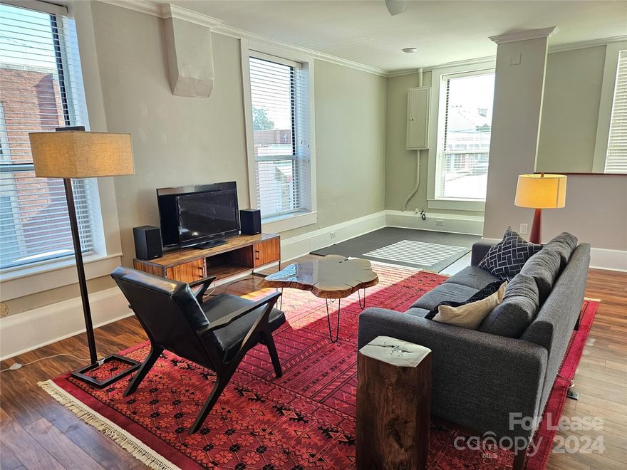 Loft Rental in Historic Downtown Morganton.  104 Queen St, above Garden Gate Florist.  Enjoy the entire, private loft style upstairs apartment, with gracious living room, kitchenette, bedroom & stack washer/dryer. Kitchette features, cooktop, microwave, dishwasher & dorm sized refrigerator.  Transunion Smartmove Credit Check & Criminal Background check required for each occupant.  Sorry no smoking products & no pets.  Centrally located near the corner of Sterling St in the heart of downtown Morganton.  Blocks from Root and Vine & Treat resturants, Homer's Oyster Bar, The Grind Coffee Shop, the historic courthouse square, the movie theather, Brown Mountain Bottle Works, Fonta Flora Brewery, Pat's Snack Bar, Uncle Eee's, Limbertwigs Cafe, Kin Kin Sushi, multiple banks, churches & local businesses.  Add'l entertainment options in the vincity include the TGIF Summer Concert Series, the Catawba Greenway, Pisgah National Forest, Lake James, South Mountain State park & countless others.