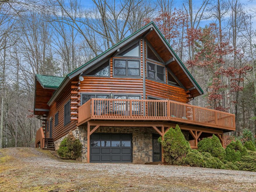 Nestled amidst the tranquil beauty of Waynesville, NC, this traditional log cabin offers an idyllic retreat with breathtaking long-range views of the majestic Blue Ridge Mountains, including Cold Mountain. Well-positioned to enjoy the splendor of the nearby Great Smoky Mountains, this property is a haven for nature lovers and those seeking serene mountain living. Step inside this spacious cabin where you'll find a warm and inviting atmosphere spread across 3 bedrooms and 3 full baths. The large front deck acts front row seat to an ever changing landscape with year round mountain vistas that inspire and relax. Surrounded by 1.90 acres of land, there's a blend of openness and wooded privacy, while the level backyard offers a perfect canvas for outdoor gatherings, gardening, or simply enjoying the crisp mountain air. Bright and airy, the cabin features expansive windows that welcome in natural light. Make this traditional cabin your own!