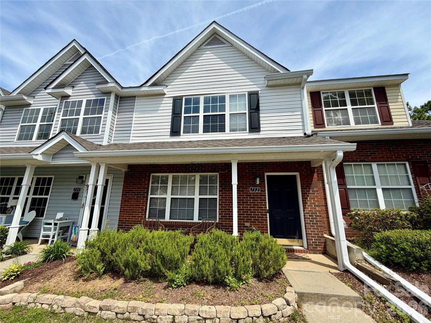 Discover this updated 2 bedroom 2.5 bath move-in ready 2 story townhome in the award-winning Fort Mill school district! A covered front porch leads you inside to an open floorplan featuring abundant natural light & low maintenance newer luxury vinyl flooring. The chef's kitchen is a highlight showcasing new quartz countertops, kitchen island, painted custom cabinets & a new stainless steel refrigerator & stove. Bright and open living room with gas fireplace flows naturally into the dining area. Upstairs offers two spacious bedroom suites with vaulted ceilings both with private en suite baths & walk-in closets. Enjoy private outdoor living on the expanded back patio. Plenty of parking: 2 dedicated parking spots & overflow visitor spots. Large community pool for those fun summer months. Convenient to great shopping, dining, interstates & downtown Pineville. A rare gem!