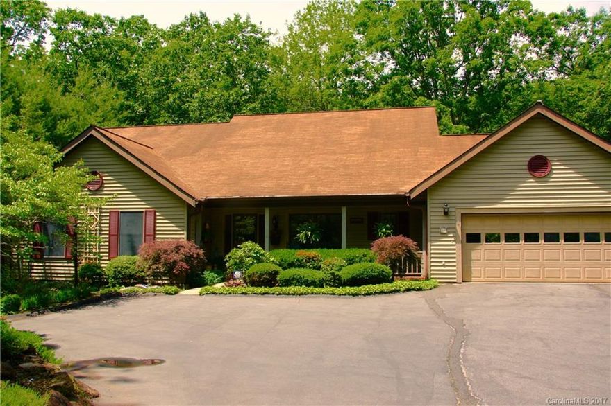 Live among the rhododendrons in this totally peaceful and beautiful home just minutes from downtown Black Mountain!  Well loved and plenty of space!  New hardwoods and updated kitchen with beautiful granite countertops and newer appliances.  From the amazing fireplace in the great room to the wonderfully secluded back deck, this one really feels like your home in the mountains. Hiking Trails!  Two-car garage on the main level and a one-car garage in basement.  New appraisal just completed.