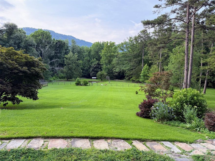 A beautiful place to call home for a few months or a few years. Owners re-located but have no plans to sell this gem of a home. Seems large because of the wide views and many spaces but the feeling is more of a cozy cabin in a gorgeous country setting once you’re inside.  Location is super private up a long driveway but still close to town and commutes. Landscaping included - good internet for work from home. FABULOUS kitchen with views and porches on both sides. Nice primary suite and an easy layout. Largest guest room w en-suite bath has bunk beds, and a third small bedroom is next to another hall bath. Large family room overlooks the expansive view. Garage is accessible from driveway and up stairs into kitchen. Babbling creek on the property.