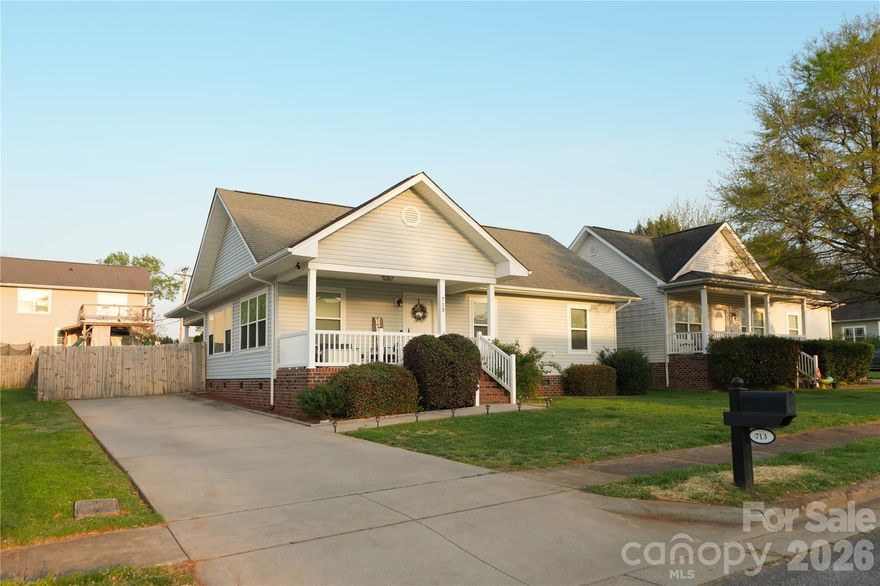 Welcome to this beautifully maintained 3-bedroom, 2-bath home offering comfort, convenience, and great curb appeal. Step inside to an inviting open-concept layout filled with natural light. The beautiful kitchen showcases blue cabinetry, stainless steel appliances, tile backsplash, farmhouse-style sink, and plenty of counter space-perfect for cooking and gatherings. Situated in a quiet, well-kept neighborhood, this single-level residence features a spacious driveway, a charming covered front porch, and neatly manicured landscaping. With a fully fenced backyard complete with a storage shed and a cozy fire pit area--perfect for outdoor gatherings, relaxing evenings, or additional storage needs. With its inviting design and well-cared-for condition, this home offers a wonderful opportunity for buyers seeking move in ready conditions.