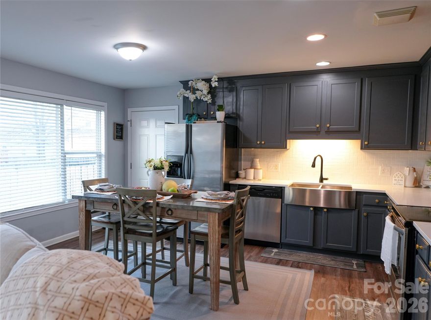 Welcome to this beautifully maintained 3-bedroom, 2-bath home offering comfort, convenience, and great curb appeal. Step inside to an inviting open-concept layout filled with natural light. The beautiful kitchen showcases blue cabinetry, stainless steel appliances, tile backsplash, farmhouse-style sink, and plenty of counter space-perfect for cooking and gatherings. Situated in a quiet, well-kept neighborhood, this single-level residence features a spacious driveway, a charming covered front porch, and neatly manicured landscaping. With a fully fenced backyard complete with a storage shed and a cozy fire pit area--perfect for outdoor gatherings, relaxing evenings, or additional storage needs. With its inviting design and well-cared-for condition, this home offers a wonderful opportunity for buyers seeking move in ready conditions.