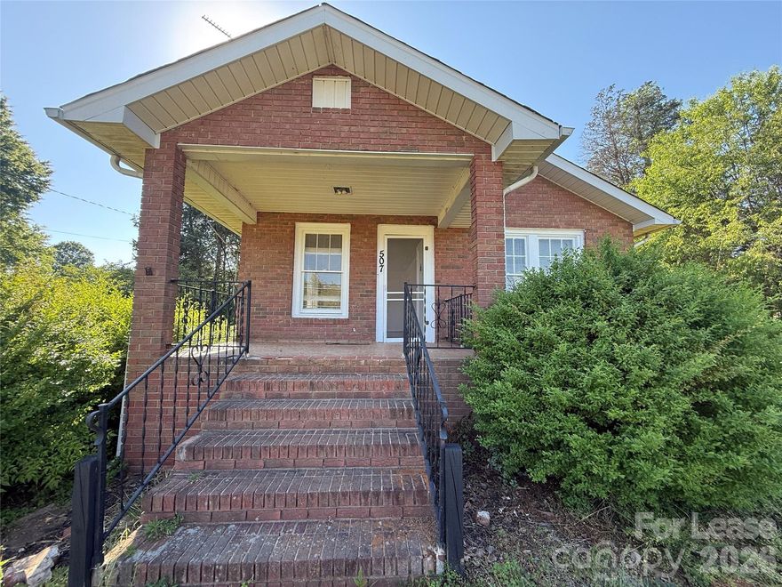 Charming brick RANCH home in Statesville, conveniently located less than 3 miles from I-40 and just a short drive to shopping and dining. This home features a neutral color palette with laminate and hardwood flooring throughout. The functional floor plan includes spacious Living and Dining areas, an open Kitchen with stainless appliances, Laundry hookups, and 2 Bedrooms that share a Full Bathroom. Enjoy outdoor living with a Covered Front Porch and a rear Covered Patio. The property also includes a Detached 2 Car Garage. The unfinished basement, accessible from both the interior and exterior, is available for storage use only. Tenant is responsible for all utilities, lawn maintenance, and trash service. No Smoking and No Pets are allowed. This home can be available as soon as one week after an approved application!