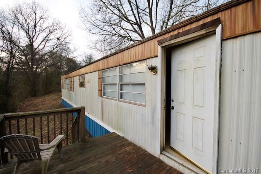 Golden opportunity for home ownership or investment in Weaverville! Nice and open floorplan with like new laminate floors, interior paint, and views off the back deck. You or your tenants will really appreciate being tucked away on your own hillside for extra privacy and to take in those views. Located just off New Stock Rd and close to shopping centers and future I-26 for easy commuting. Be sure to see this home today!