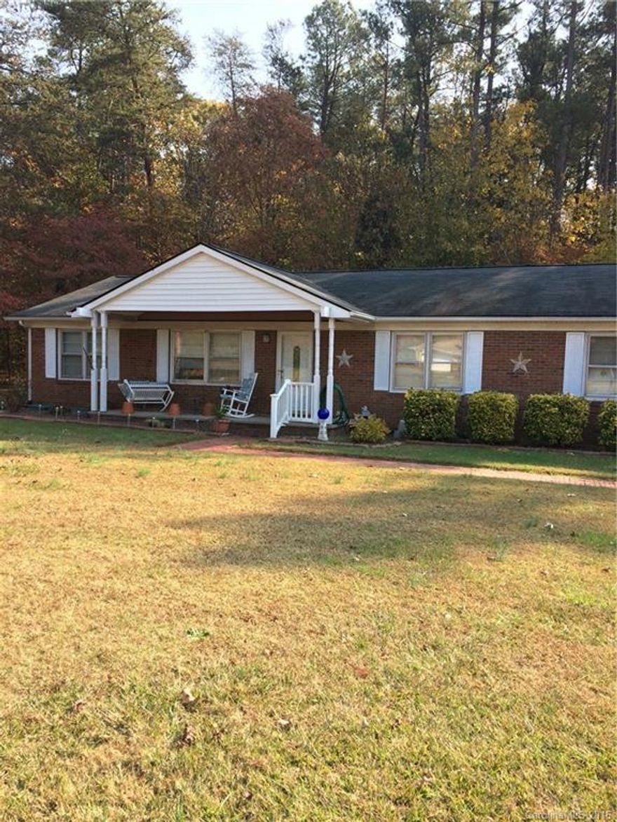 Great Home in East Rowan Schools offers tile in kitchen, den and bathrooms all it needs is a little paint.  Appliances stay.