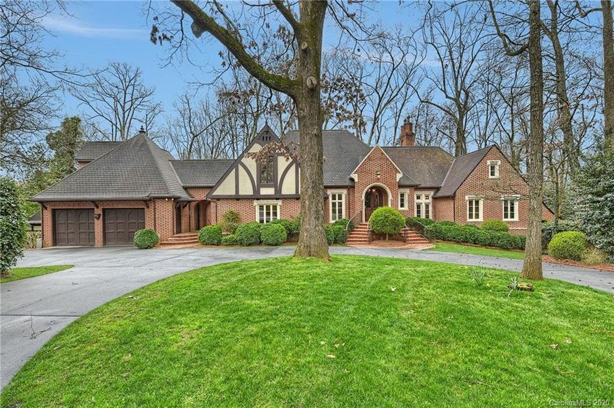 Truly one of the most enchanting and magical properties you will find in the Charlotte area.   Style of the home is a modified French Norman style with Tudor influences. This amazing 1.5 acre property mirrors the feel of being in the NC mountains with towering trees, gorgeous plantings and full of color changes throughout the seasons.  This spectacular home was custom designed and built in 1997 by a renowned Charlotte architect and antique dealer who collected the home’s precious antique treasures that are scattered throughout the home from all over the United States and abroad.  1445 Meadowood could be renovated with current layout or certainly there are endless possibilities to recreate the second floor with bedrooms and bathrooms and utilize the unfinished square footage.  The first-floor living/dining space does not get any grander! The main level balcony will certainly become your favorite space for morning coffee or afternoon wine with the breathtaking and private view.