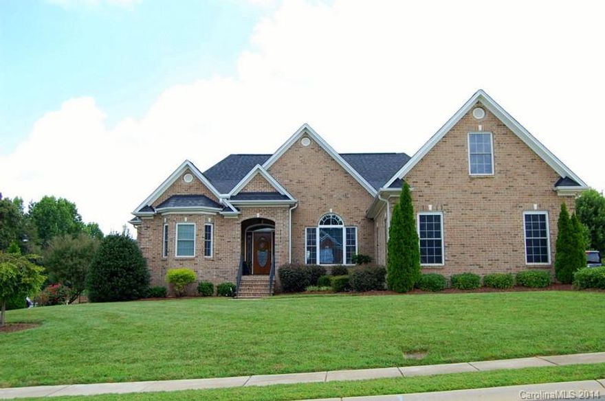 Enjoy living in this beautifully built all brick, one level home with many custom features. Wonderful open plan with hardwoods throughout, inlay tile in the sunroom that opens to the deck that wraps around back of home with access from master, all overlooking a horse pasture.