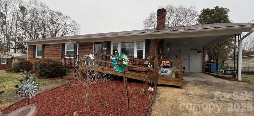 Step into this beautifully preserved 1962 brick ranch where classic charm meets thoughtful functionality. Immaculately maintained, this home showcases original hardwood floors and stunning, well-preserved vintage tile bathrooms that offer a timeless nod to its era. The inviting sun porch provides the perfect transition into a private mother-in-law suite, ideal for extended family, guests, or flexible living arrangements. With dual laundry areas, convenience is built right in. Pet lovers will appreciate the uniquely crafted, solid built-in pet doors are just one example of the thoughtful details throughout. A detached workshop offers additional space for hobbies, storage, or creative projects.

Every inch of this home reflects pride of ownership. Clean, charming, and exceptionally well cared for, this is a rare opportunity to own a truly special property with character you simply can’t recreate. The backyard has decorative fencing as well as an underground system.