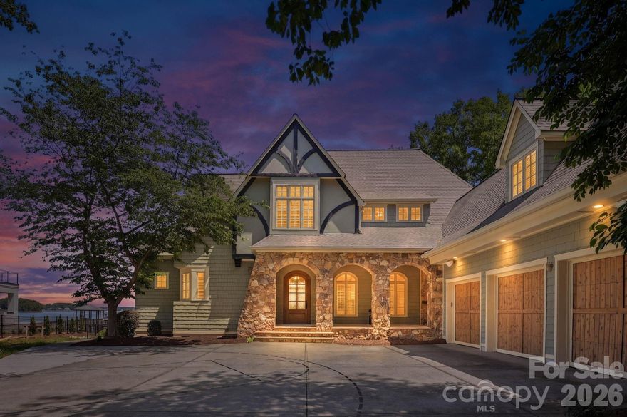Experience the ultimate waterfront lifestyle at 3900 Channel Point Lane, a stunning property nestled on a private cul-de-sac lot in the highly coveted Sailview community. This home offers a rare and remarkable vantage point with breathtaking, panoramic views of Lake Norman from both the front and the back of the house, ensuring the lake's beauty is your constant backdrop from every angle.
Steps from your back door, you can enjoy a private floating dock and pier, providing effortless access to the main channel for boating or swimming. The waterfront setup is a boater’s dream, featuring a high-capacity boat lift, an additional covered slip for year-round protection, and two dedicated personal watercraft docks for your jet skis. The backyard has been completely transformed into a private oasis featuring a newly installed, high-end saltwater pool and integrated spa. This custom aquatic retreat is finished with a premium pebble tec surface for lasting durability and a natural aesthetic, all easily managed via wireless Jandy controls for seamless operation from your smartphone. Low-maintenance astroturf surrounds the pool area, creating a lush, evergreen space for year-round enjoyment, while the exquisite rear terrace remains perfect for entertaining with its professional-grade built-in grill, granite countertops, and elegant gas lanterns.
Inside, the home has been meticulously updated with modern finishes and refined details throughout. The gourmet kitchen serves as the heart of the home, having undergone a complete transformation to satisfy the most discerning chef. It features an updated layout with a massive center island and stunning new countertops that seamlessly continue up the backsplash for a sleek, contemporary look. The kitchen is fully equipped with high-end, new stainless steel appliances, including a high-performance gas cooktop, all framed by freshly updated cabinetry. Throughout the residence, you will find updated fixtures, graceful archways, and built-in bookshelves that add a touch of timeless sophistication.
The living spaces are designed to maximize the incredible scenery, highlighted by a gorgeous sunroom addition that boasts a stone fireplace, a wet bar, and a wall of windows framing panoramic water views. The spacious main-level primary bedroom serves as a private retreat, featuring a cozy window seat and French doors that open directly to the lakefront terrace. Situated at the end of a quiet cul-de-sac, this home offers rare privacy and unique dual-side lake vistas that are truly hard to find. Residents also enjoy the premier amenities of Sailview, including a clubhouse, community pool, tennis courts, pickle ball and sand volley ball. Don’t miss out on making this lakeside sanctuary your own!