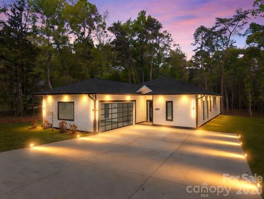 New Construction on 1+ Acre with No HOA – Modern Custom Home in Southwest Charlotte
Stunning new construction home located in the growing Southwest Charlotte / Steele Creek area sitting on over 1 acre with no HOA. This custom built 3 bedroom, 3.5 bathroom home offers approximately 2,700 heated square feet with a spacious 2.5 car garage and long driveway that can accommodate 5+ vehicles.
This home features a 1-story open floor plan with 10-foot ceilings throughout, large living room with electric fireplace, and a modern kitchen featuring white quartz countertops, oversized kitchen island with storage, stainless steel appliances, and smart refrigerator with built-in screen. Large pantry and separate laundry room with brand new washer/dryer and built-in dog wash station.
All bedrooms include walk-in closets and private bathrooms. The primary bathroom features a large double vanity over 9 feet long, custom tile shower with glass walls, and modern finishes throughout.
Exterior features include Hardie board siding with custom cement brick front design, large back patio perfect for entertaining, and a long private driveway. The 1.01 acre lot provides privacy while still being close to shopping, restaurants, Charlotte Premium Outlets, Lake Wylie, I-485, and Charlotte Douglas Airport.
This home offers modern construction, large lot, no HOA, and convenient Charlotte location — a rare combination