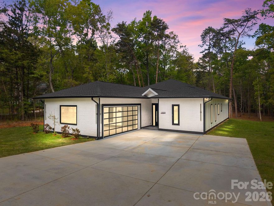 New Construction on 1+ Acre with No HOA – Modern Custom Home in Southwest Charlotte
Stunning new construction home located in the growing Southwest Charlotte / Steele Creek area sitting on over 1 acre with no HOA. This custom built 3 bedroom, 3.5 bathroom home offers approximately 2,700 heated square feet with a spacious 2.5 car garage and long driveway that can accommodate 5+ vehicles.
This home features a 1-story open floor plan with 10-foot ceilings throughout, large living room with electric fireplace, and a modern kitchen featuring white quartz countertops, oversized kitchen island with storage, stainless steel appliances, and smart refrigerator with built-in screen. Large pantry and separate laundry room with brand new washer/dryer and built-in dog wash station.
All bedrooms include walk-in closets and private bathrooms. The primary bathroom features a large double vanity over 9 feet long, custom tile shower with glass walls, and modern finishes throughout.
Exterior features include Hardie board siding with custom cement brick front design, large back patio perfect for entertaining, and a long private driveway. The 1.01 acre lot provides privacy while still being close to shopping, restaurants, Charlotte Premium Outlets, Lake Wylie, I-485, and Charlotte Douglas Airport.
This home offers modern construction, large lot, no HOA, and convenient Charlotte location — a rare combination