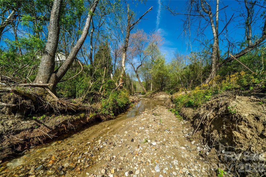 Tucked away in a peaceful, country setting yet just minutes from everything Henderson County has to offer, this approximately one-acre parcel presents a rare opportunity to create your ideal mountain retreat. The land is flat, usable, and appears well-suited for building—making it an excellent option for a primary residence, second home, or investment property.
This property offers the convenience of access to city water and electricity, along with a successful perc test already completed for a septic system (not yet installed), giving you a strong head start toward building.
With no known restrictions, the possibilities here are wide open—including potential for subdivision (buyer and buyer’s agent to verify with Henderson County zoning). Whether you’re envisioning a private homestead, a small development opportunity, or a peaceful getaway, this property delivers the best of both worlds—quiet surroundings with easy access to shopping, dining, and everyday conveniences in town.