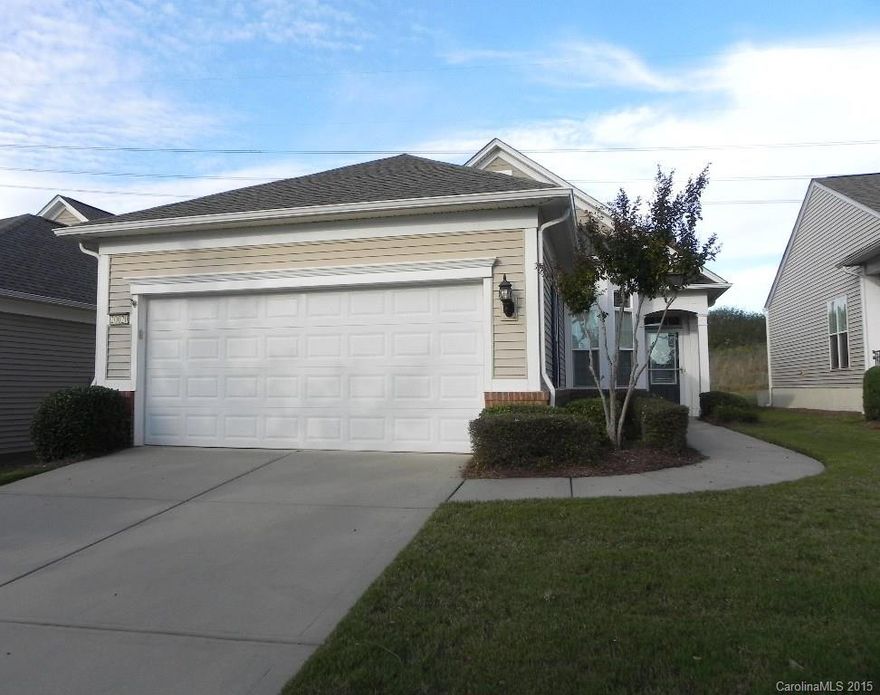 This 2BR/2BA Gray Myst features a sunroom, fenced patio and automatic awning.  The yard backs up to a berm offering privacy and green space.  The interior has stainless appliances, Corian counters, smooth top electric stove, new Whirlpool dishwasher and includes the kitchen refrigerator.  Pergo flooring throughout the living area and ceramic tile in baths and laundry. This home is move-in ready!  Come check out the community and the active adult lifestyle of Sun City Carolina Lakes.