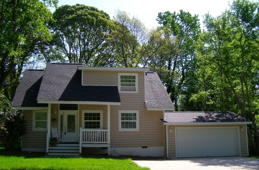 Home has been completely remodelled. Following items ALL NEW - Rewired, replumbed, new roof, kitchen with granite tops, bathrooms, windows, hvac, tankless hot water system, brand new engineered hardwood floors throughout the main floor. Huge oversized windows in the Great Room with high ceiling and gas fireplace. SS appliances, walk in pantry in the kitchen, lighting. New carpets & newly painted. Old Tega Cay on The Cove - large golf course lot. Amenities boat ramps, pool, parks, walking trails