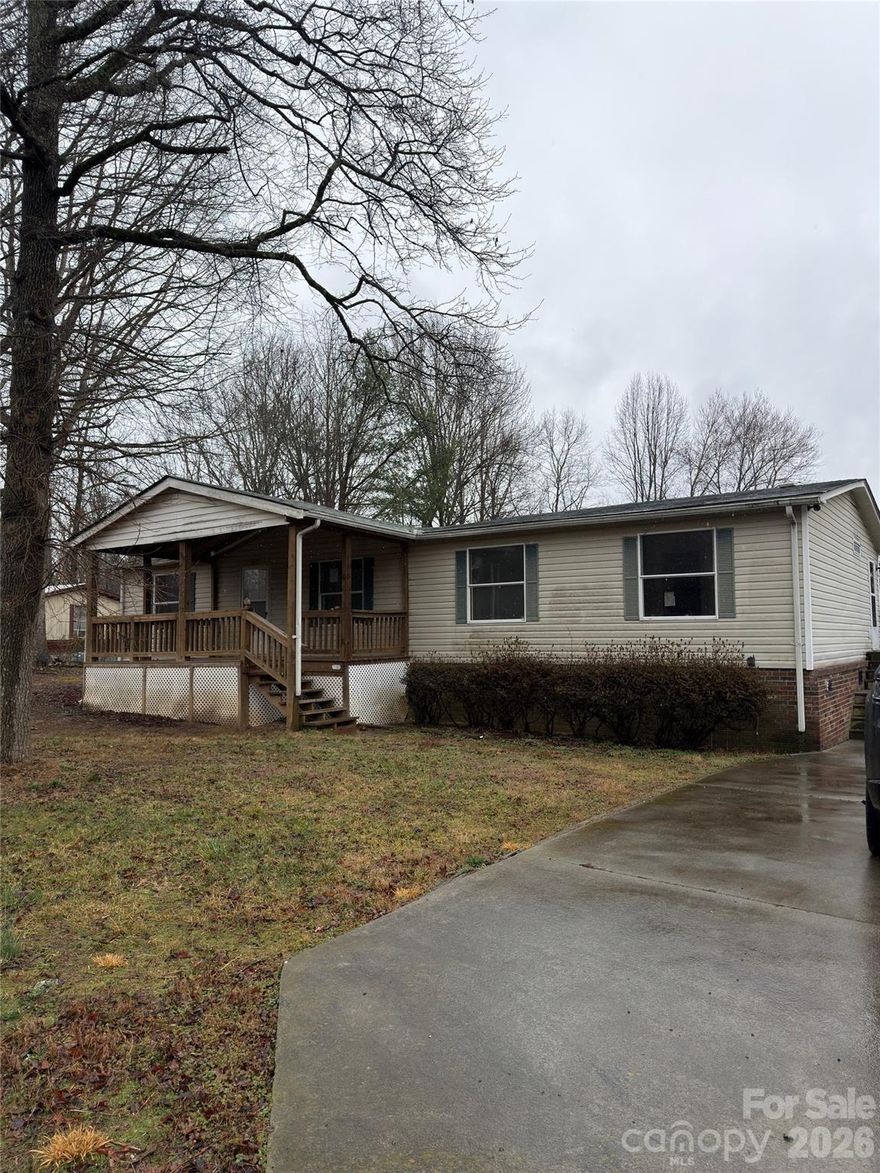 3 bed 2 bath home with covered deck. enclosed porch, outbuilding, and carport. This single level floorplan includes a master suite, 2 addt bedrooms w 2nd centrally located bathroom, living room, laundry room, and dining area. Needs some finishing touches that may limit financing options. Home sold AS-IS/WHERE-IS with ALL FAULTS. Buyer or buyers agent to verify all stats. Seller nor sellers agent make any claims or warranties as to quality or condition of home, its mechanicals, or the property boundary locations.