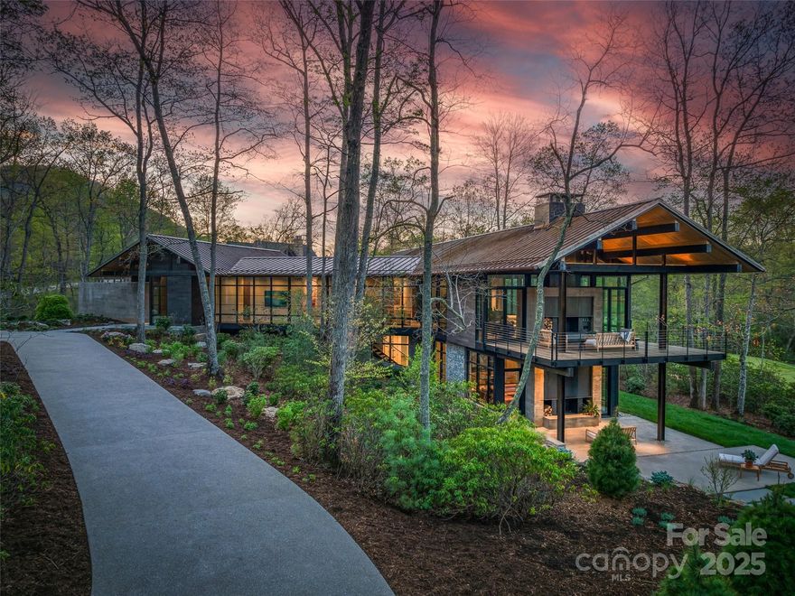 Step into the pinnacle of contemporary luxury with this stunning home by Jade Mountain Builders. Discover the perfect blend of modern design and natural serenity in this architectural masterpiece, nestled in the tranquil beauty of The Cliffs at Walnut Cove. Designed by Harding Huebner to harmonize with the surrounding landscape, the home offers a lifestyle of refined peace and elegance. Inside, you'll be welcomed by warm, light-filled spaces, where expansive windows frame breathtaking views of lush greenery, the mountains, and the golf course. Enjoy easy access to upscale dining and top-tier amenities, all within a private, gated community. Now offered at an improved price, this home presents an even more compelling opportunity to own a slice of mountain paradise. A Cliffs Membership is available for purchase, providing access to all seven Cliffs communities.